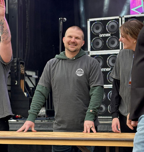 Ben (The Green Bay Guy) standing on a stage awaiting to partake in a pulled pork eating contest