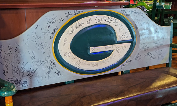 A Packers themed bench in El Sarape signed by Packers players